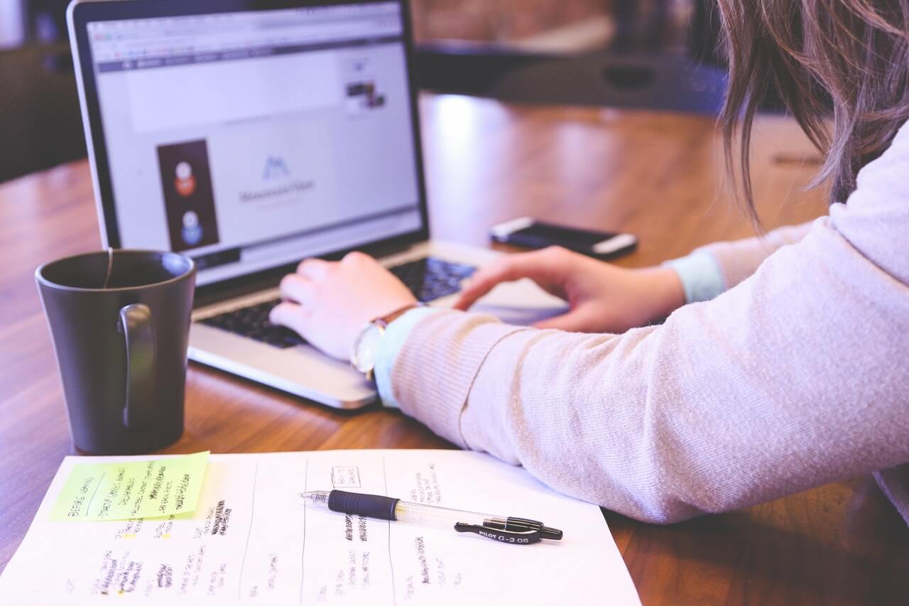 a landlord prepares to upload a video tour of their rental to an online listing site